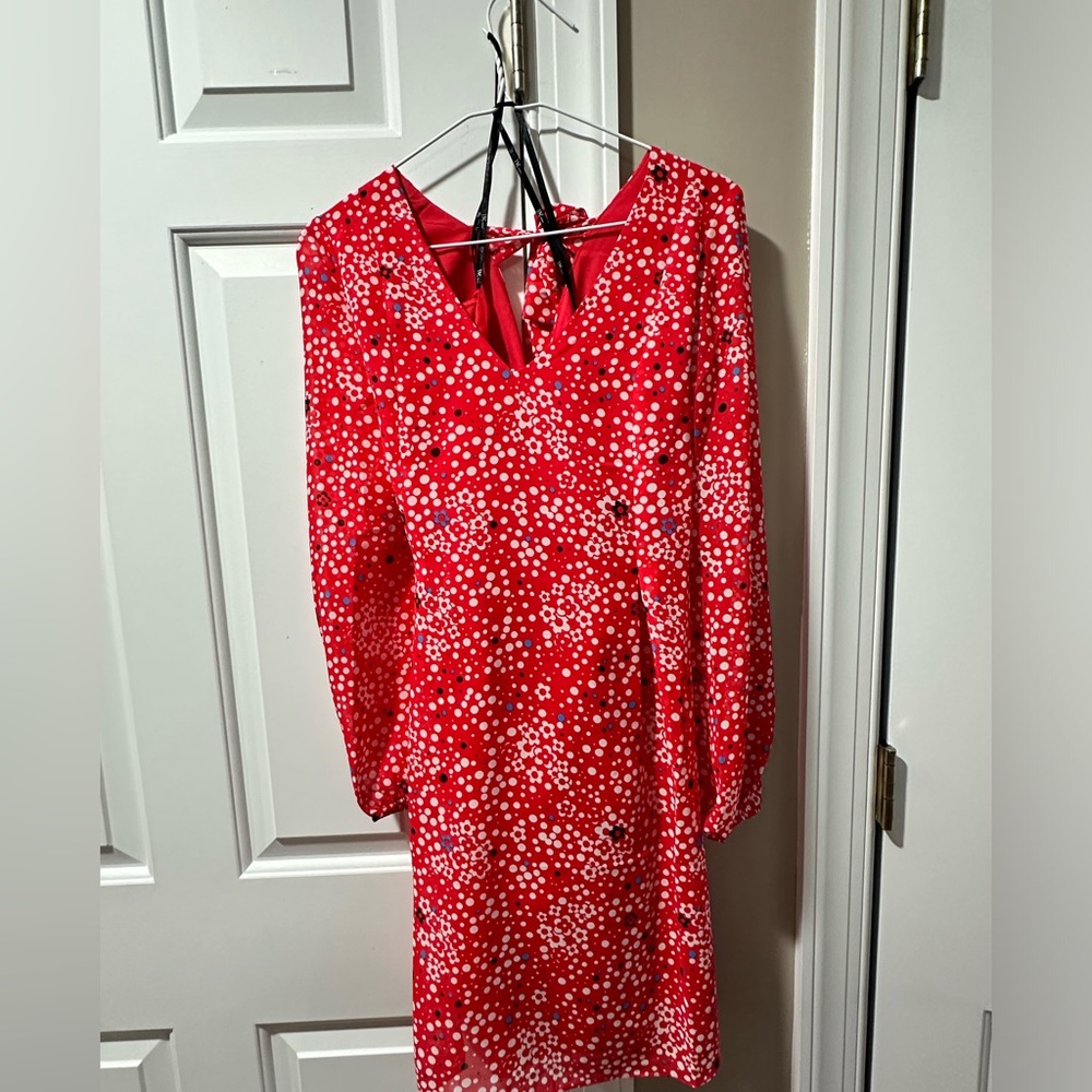 I.N.C. International Concepts® breezy shift dress features a bow-detail back.